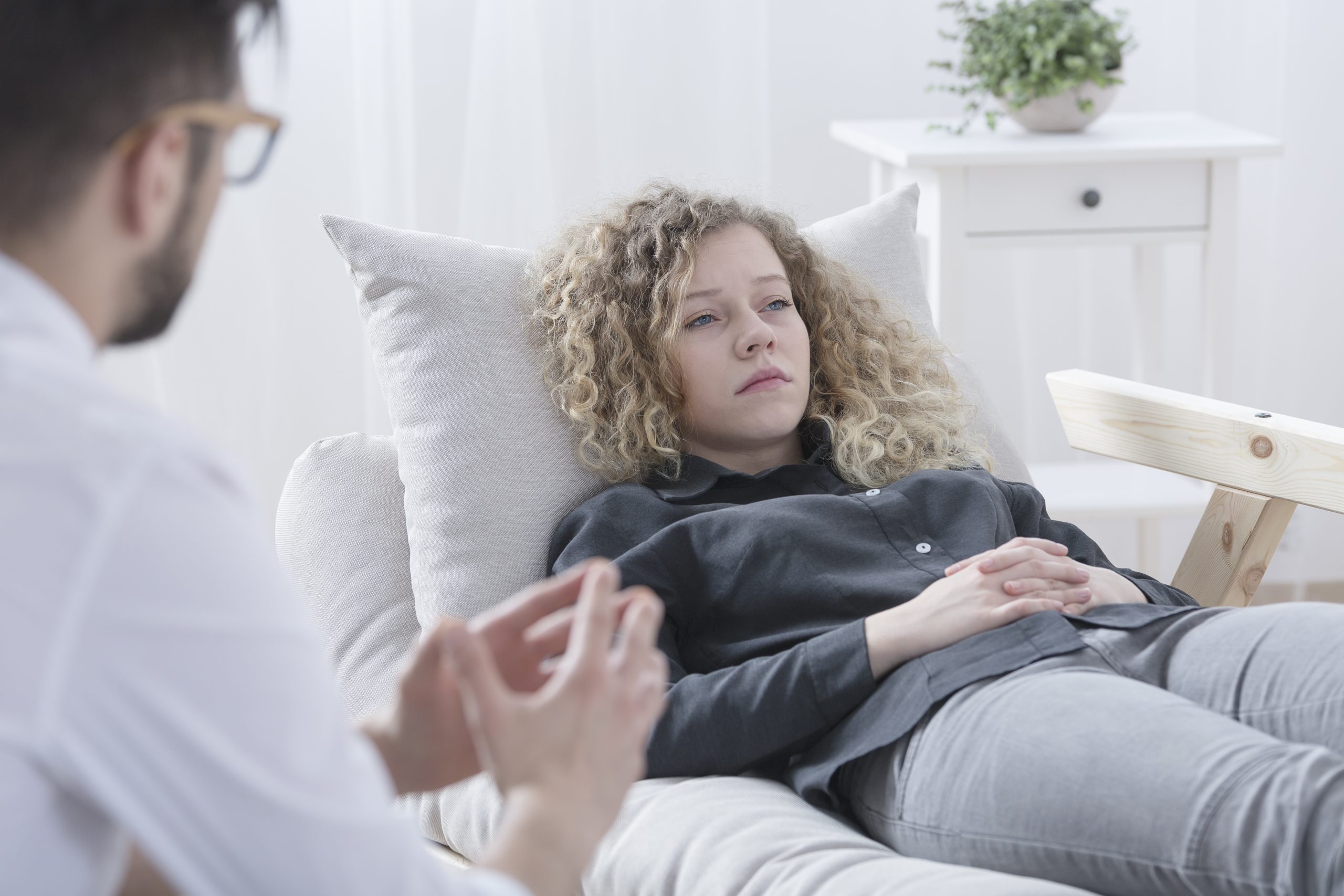 young-patient-lying-on-counseling-sofa